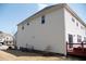 Side view of the home featuring siding, a well-maintained lawn, and AC units at 212 Liberty Rose Dr, Morrisville, NC 27560