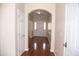 Bright foyer featuring hardwood floors, neutral walls, and classic white trim at 212 Liberty Rose Dr, Morrisville, NC 27560