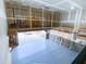 Garage featuring epoxy flooring, storage and ample space for parking at 212 Liberty Rose Dr, Morrisville, NC 27560