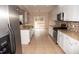 Updated kitchen with stainless steel appliances, granite countertops, and tile backsplash at 212 Liberty Rose Dr, Morrisville, NC 27560