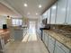 Open kitchen featuring stainless appliances, breakfast bar, and view of living and dining area at 212 Liberty Rose Dr, Morrisville, NC 27560