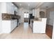 Open kitchen layout with granite countertops, stainless appliances, and lots of natural light at 212 Liberty Rose Dr, Morrisville, NC 27560