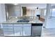 Kitchen boasts stainless steel dishwasher, granite countertop, and sink with breakfast bar at 212 Liberty Rose Dr, Morrisville, NC 27560