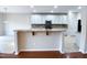 Spacious open-concept kitchen featuring granite counters, stainless appliances, and modern cabinets at 212 Liberty Rose Dr, Morrisville, NC 27560