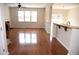 Open living room boasts hardwood floors, fireplace, and natural light from large windows at 212 Liberty Rose Dr, Morrisville, NC 27560