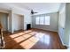 Spacious living room featuring hardwood floors, a fireplace, and natural light at 212 Liberty Rose Dr, Morrisville, NC 27560