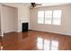 Bright living room with hardwood floors and a fireplace at 212 Liberty Rose Dr, Morrisville, NC 27560
