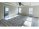 Large main bedroom with plush carpeting, tray ceiling, and ample natural light at 212 Liberty Rose Dr, Morrisville, NC 27560