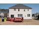 Exterior of a two-story home with a spacious backyard featuring a deck at 212 Liberty Rose Dr, Morrisville, NC 27560