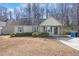 Charming single-story home features a cozy front porch and blue shutters at 220 Courtland Dr, Angier, NC 27501