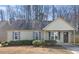 Charming single-story home features a cozy front porch and blue shutters at 220 Courtland Dr, Angier, NC 27501