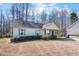 Charming single-story home features a cozy front porch and blue shutters at 220 Courtland Dr, Angier, NC 27501
