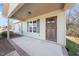 Inviting front porch featuring a well-maintained yard and stylish front door at 220 Courtland Dr, Angier, NC 27501
