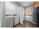 Laundry room with a washer, dryer, wire shelving, and a window at 220 Courtland Dr, Angier, NC 27501