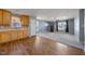 Spacious living room with carpet flooring, a window, and a front door, open to the kitchen at 220 Courtland Dr, Angier, NC 27501