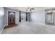 Spacious living room with carpet flooring, a window, and a front door at 220 Courtland Dr, Angier, NC 27501