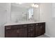 A spacious bathroom features a double vanity and large mirror at 223 Frosted Iris Lane Ln # 176, Garner, NC 27529