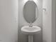 A stylish half-bathroom featuring modern fixtures and decor at 223 Frosted Iris Lane Ln # 176, Garner, NC 27529