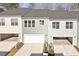 This beautiful townhome features three garage doors and complimentary landscaping at 223 Frosted Iris Lane Ln # 176, Garner, NC 27529