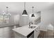 Open kitchen view to living room and stairway at 223 Frosted Iris Lane Ln # 176, Garner, NC 27529