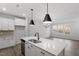 New kitchen with island, stainless steel appliances and view to living room at 223 Frosted Iris Lane Ln # 176, Garner, NC 27529