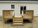 Close up of the back deck made of wood, featuring stairs and railings at 2242 Eldridge Rd, Newton Grove, NC 28366