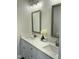 Elegant bathroom with double vanity, white countertops, and decorative floral arrangement at 2242 Eldridge Rd, Newton Grove, NC 28366