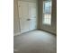 Carpeted bedroom with a window and a closet at 2242 Eldridge Rd, Newton Grove, NC 28366