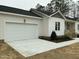 The exterior of the single story home with a garage and covered porch and steps at 2242 Eldridge Rd, Newton Grove, NC 28366