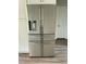 Close up shot of the stainless steel refrigerator in the kitchen at 2242 Eldridge Rd, Newton Grove, NC 28366