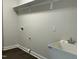 Utility/laundry room featuring a utility sink, neutral walls, shelving and modern fixtures at 2242 Eldridge Rd, Newton Grove, NC 28366