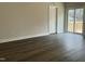 Bright living room with wood floors, a sliding door to a deck, and white trim at 2242 Eldridge Rd, Newton Grove, NC 28366