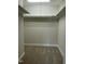 Spacious walk-in closet with carpet floors and white shelving, offering ample storage at 2242 Eldridge Rd, Newton Grove, NC 28366