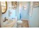 Well-lit bathroom featuring modern fixtures, blue walls, and decorative accents at 2513 Boothbay Ct, Raleigh, NC 27613