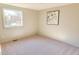 Cozy bedroom featuring neutral walls, carpet flooring, and a window view at 2513 Boothbay Ct, Raleigh, NC 27613