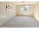 Sunlit bedroom featuring neutral carpet, a large window, offering a cozy space for relaxation at 2513 Boothbay Ct, Raleigh, NC 27613