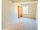 Bright bedroom with a ceiling fan, light-colored carpet, and a window offering natural light at 2513 Boothbay Ct, Raleigh, NC 27613