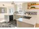 Modern kitchen featuring white cabinets, granite countertops, stainless steel appliances, and stylish tile backsplash at 2513 Boothbay Ct, Raleigh, NC 27613