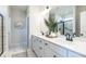 Elegant bathroom with dual sinks, granite countertops, and a glass-enclosed shower at 275 Deodora Ln, Cameron, NC 28326