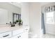 Well-lit bathroom featuring a white vanity, a white toilet, and a tub shower at 275 Deodora Ln, Cameron, NC 28326