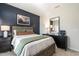 Cozy bedroom boasting dark blue accent wall, and stylish decor with abundant natural light at 275 Deodora Ln, Cameron, NC 28326