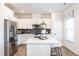Bright kitchen boasts stainless steel appliances, granite countertops, and white cabinets with a center island at 275 Deodora Ln, Cameron, NC 28326