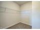 A well-lit carpeted walk-in closet, featuring white wire shelving and trim throughout at 275 Deodora Ln, Cameron, NC 28326