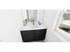Stylish powder room with modern vanity, sleek fixtures, and patterned flooring at 301 Beacon Dr, Pittsboro, NC 27312