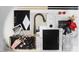 Modern kitchen fixtures are showcased, including cabinetry, countertops, faucet, and hardware at 301 Beacon Dr, Pittsboro, NC 27312