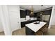 Modern kitchen with a large island, stainless steel appliances, and sleek cabinetry at 301 Beacon Dr, Pittsboro, NC 27312