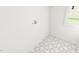 Clean and functional laundry room with patterned tile flooring at 301 Beacon Dr, Pittsboro, NC 27312