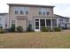Backyard featuring a screened-in porch and green landscaping at 311 Silverhawk Ln, Durham, NC 27703