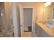 This bathroom offers a neutral color palette, double sink, granite counters and shower at 311 Silverhawk Ln, Durham, NC 27703