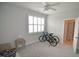 This bedroom features neutral carpet, plantation shutters, ceiling fan, and an ensuite bathroom at 311 Silverhawk Ln, Durham, NC 27703